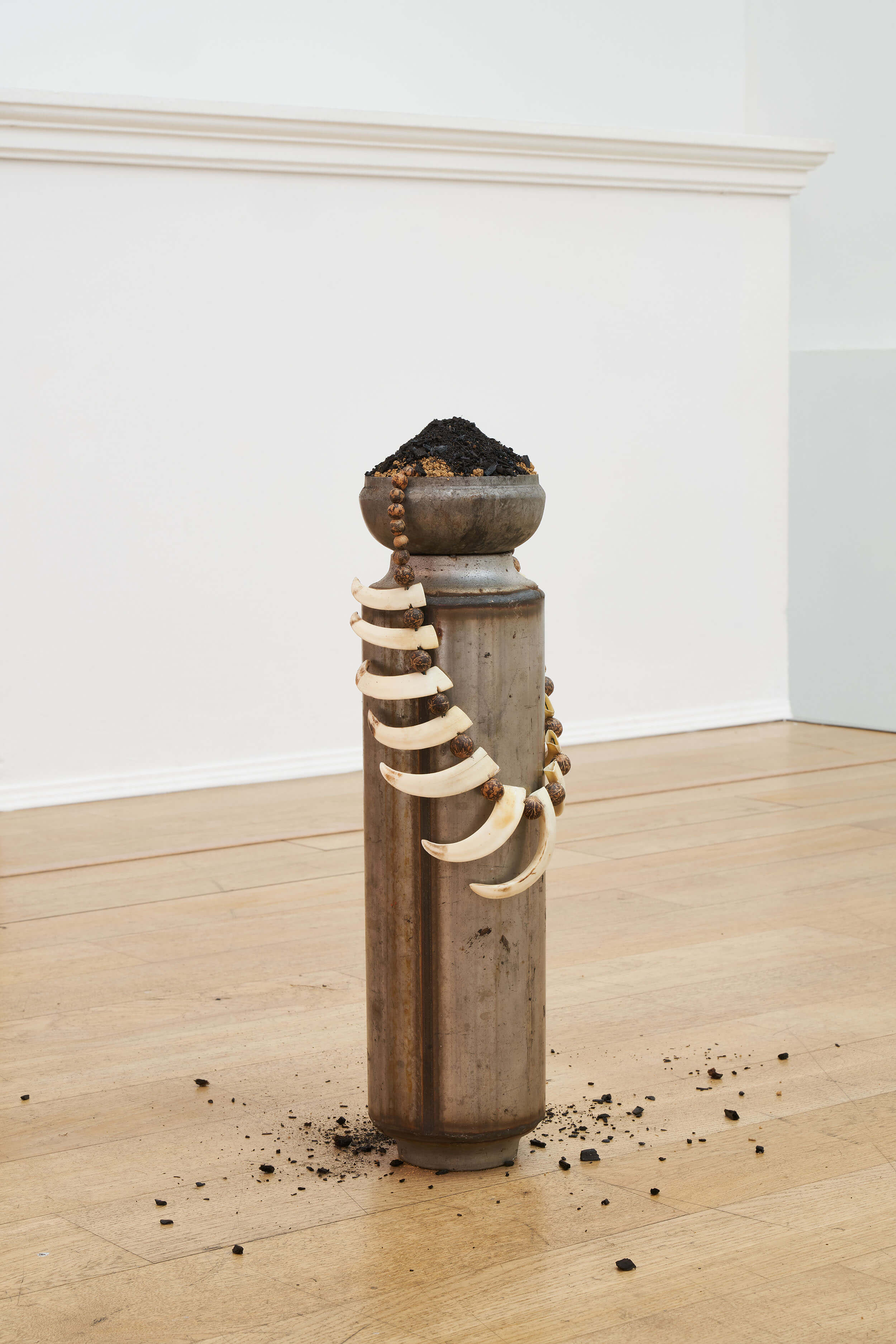 Edoardo Caimi, Melancholy object - Home smell, 2019, iron, clay, ash and Amazonian necklace, 50 × 13 × 10 cm Installation view of last exhibition at the gallery