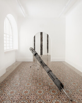 Installation view of the solo show of Nicola Ghirardelli, Named Giardino in cenere at The Address, 2024. Sicomoro (2024), is de facto one of the main installations within the exhibition. The work is composed of four terracotta trees, produced using the bucchero technique - a firing process in the absence of oxygen, which, thanks to the combustion of wood, branches and sawdust, allows ferrous oxide to develop, producing a characteristic metallic black colour on the sculptures. Installation view of last exhibition at the gallery